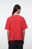 Relaxed red T-shirt with crew neck and short sleeves, shown from the back