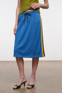 Blue midi skirt with olive trim stripe, elastic waist and drawstring; mid-calf length.