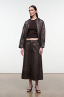 Dark brown leather culottes with button waist, zip fly, and wide cropped legs.