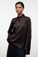 Front view earth-brown silk top with stand collar, long sleeves, button placket
