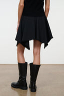 Black asymmetrical mini skirt with cascading panels and frayed lower edge