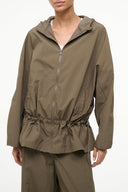 Women’s truffle olive zip-up jacket with stand collar and gathered peplum hem