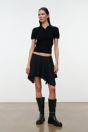 Black short skirt with draped front and uneven frayed hem