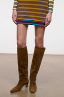 Tall brown suede riding boots with pointed toe and low stacked heel
