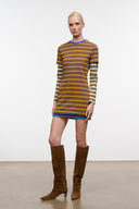 Pair of tall brown suede boots with pointed toe and stacked heel