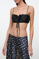 Black silk bandeau top with spaghetti straps, ruched center and drawstring ties