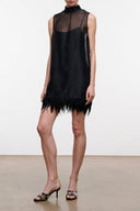 Black sleeveless mini dress with sheer top and feathered hem