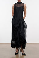 Black sleeveless mesh dress with draped waist and feathered hem