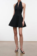 Black halter mini dress with fitted bodice and flared skirt