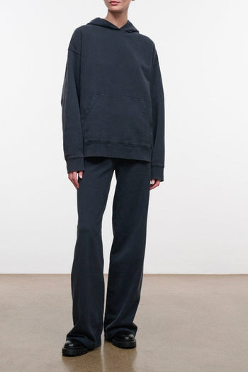 Washed black terry pants with relaxed straight-leg fit and elastic waistband