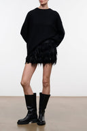 Black Moxie skirt with black feathered fringe hem, above-knee length