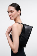 Back view of black snakeskin-textured clutch with top opening and strap