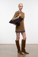 Large suede tote bag held across body, dark espresso with wide opening