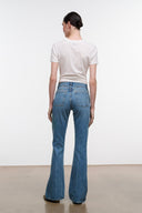 Blue flare jeans back view with rear yoke and patch pockets
