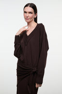 Dark oak knit sweater dress with V-neck and long sleeves, waist tie at front