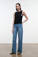 Blue denim jeans with wide straight legs, belt loops, front pockets, clean hem