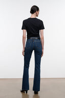 Indigo flare jeans, back view with belt loops and center seam