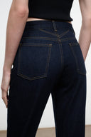 Dark indigo straight jeans with back yoke and two patch pockets, contrast stitching