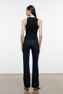 Straight-leg indigo jeans shown from the back with patch pockets and belt-loop waistband