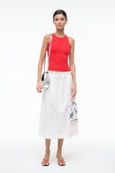 Silver crescent bag with short handle carried by model