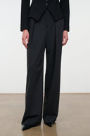 Tailored wide-leg trousers with front crease and full-length drape