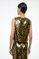 Sleeveless sequin top, back view, yellow-and-black mosaic dot pattern