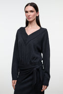 Charcoal V-neck sweater dress with long sleeves and tied waist detail
