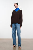 Brown knit sweater with blue-green cowl neck, relaxed fit