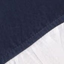 Navy fabric edge with white ruffle trim on swim shorts