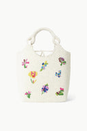 Off-white beaded tote bag with colorful butterfly and flower appliques