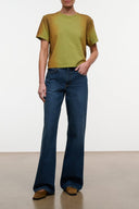 Relaxed-fit blue heritage jeans with wide straight legs and five-pocket design.