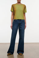 Relaxed-fit dark blue jeans with wide straight legs, belt loops, and front pockets.