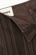 Dark brown pinstripe jeans interior with brand label and pocket seam detail