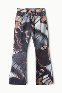 Multicolor abstract-print flare jeans with dark base and orange/white patterning