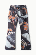 Abstract-print flare jeans, dark with orange and white swirls, flared leg