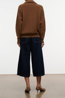 Indigo denim culotte jeans, back view with wide legs and yoke seam detailing