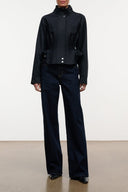 Black zip-up jacket with stand collar and chest pocket details