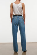 High-rise blue denim jeans, back view with belt loops and patch pockets