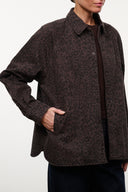 Myles shirt jacket close-up: dark brown leopard print, button placket, long cuffed sleeve