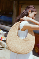 <p>A go-to for warm weather escapes, our softer woven raffia Moon does double duty as both an everyday tote and a chic beach bag.</p>