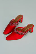 <p>A hand-beaded trim lends movement to the Joanna Mule's classic silhouette.</p>