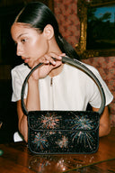 <p>Our hand-beaded Tommy Bag is the ultimate companion for looks day or night. Updated each season in statement motifs.</p>