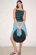 <p>A go-to for warm weather escapes, our softer woven raffia Moon does double duty as both an everyday tote and a chic beach bag.</p>