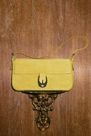 <p>The Moon's universe is ever-expanding. Look for crescent-inspired hardware across handbags, footwear, and ready-to-wear.</p>