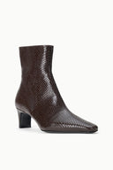 Espresso brown snake-textured ankle boot with block heel, angled side view