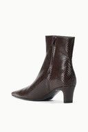 Espresso brown snake-textured ankle boot with sleek pointed toe and mid heel