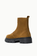 Cigar-brown suede ankle boot with pull tab and chunky black platform lug sole