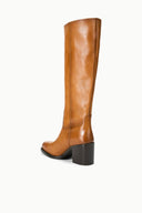 Cashew brown tall pull-on boot with smooth shaft and block heel