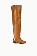 Cashew brown over-the-knee boots with pointed toe and black block heel