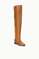 Cashew brown over-the-knee boots, tall pull-on shaft and black block heel